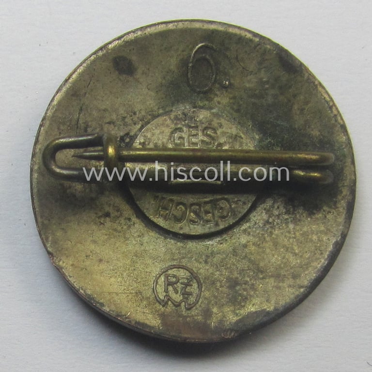 Unusual - smaller-sized- and darker-red-coloured! - 'N.S.D.A.P.'-membership-pin- ie. party-badge (or: 'Parteiabzeichen') being a maker- (ie. '6.'- or: 'Karl Hensler'-) marked example that shows a 'Ges.Gesch.'-patent-pending-designation