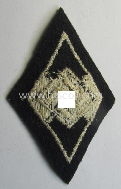 Waffen-SS-pattern, machine-embroidered and/or black- and white-coloured sleeve-insignia (ie. 'Ärmelraute') depicting a so-called: 'HJ-Raute' as was used and intended to signify former membership within the 'Hitlerjugend'