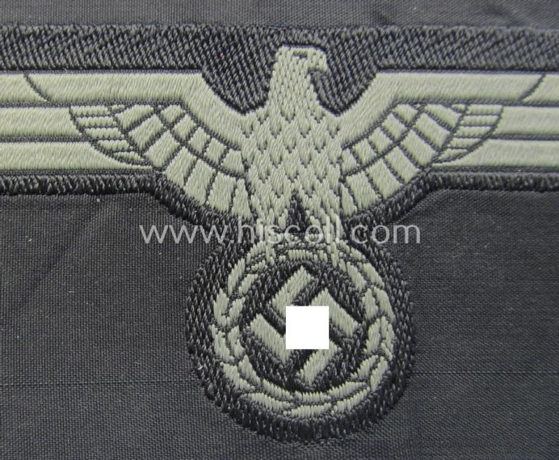 Later- (ie. mid-war-) period, WH (Heeres) 'Panzer'-type breast-eagle (ie. 'Brustadler für Panzertruppen') being a 'virtually mint- ie. unissued' example as executed in bluish-grey-coloured linnen on a black-coloured background