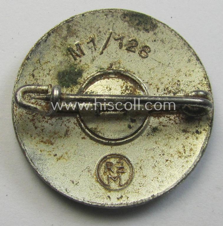 Neatly enamelled- (and darker-red-coloured) 'N.S.D.A.P.'-membership-pin- ie. party-badge (or: 'Parteiabzeichen') which is nicely maker-marked on the back with the (rarely seen!) makers'-designation: 'RzM' and/or: 'M1/128'