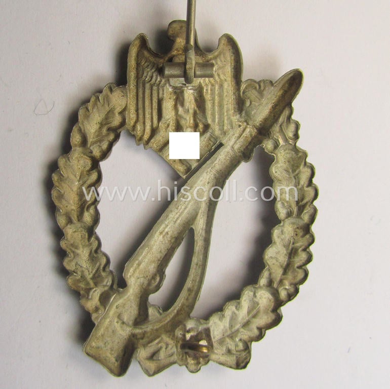 'Infanterie Sturmabzeichen in Silber' (or: silver-class infantry-assault-badge ie. IAB) being a 'Buntmetall'-based example by the: 'Otto Schickle'-company