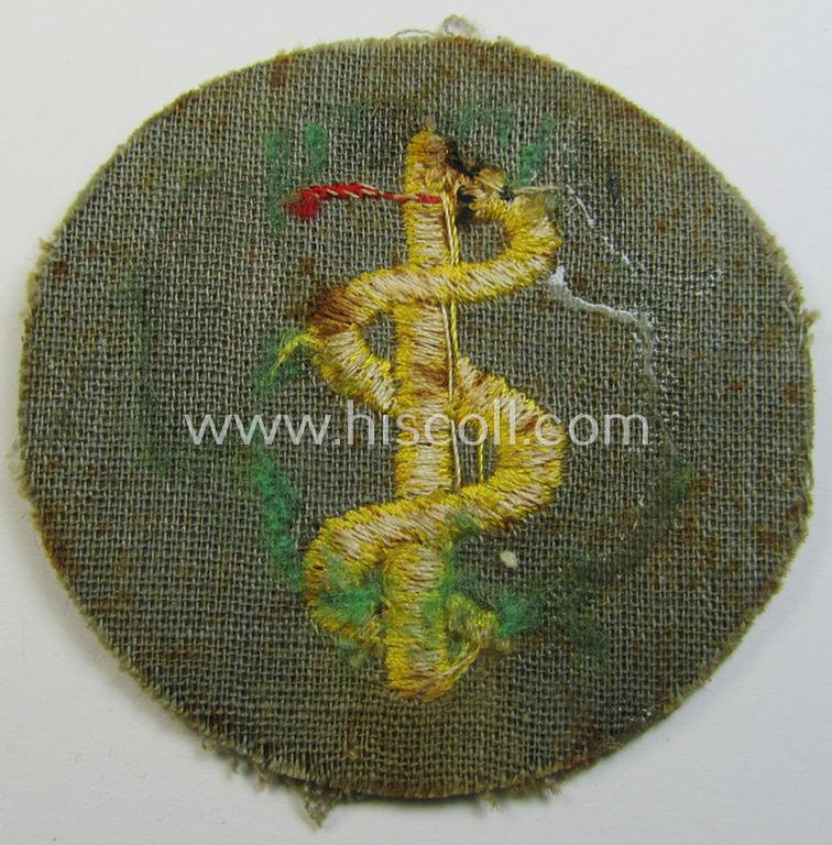 Neat, WH (Heeres) 'tropical'-issue, trade- and/or special-career insignia (ie. machine-embroidered 'Laufbahn- o. Tätigkeitsabzeichen') as was intended for an army: 'Sanitäter' (or: medical-orderly ie. NCO)