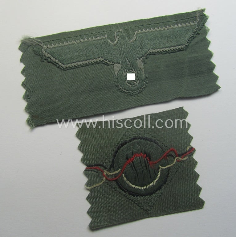 Early- (ie. mid-) war-period, WH (Heeres) cap-eagle & cocarde-set (ie. 'Schiffchenmützen-Adler u. Kokarde-Satz für Mannschaften u. Uffz.') being a 'virtually mint' set as executed in bluish-grey-coloured linnen on a field-grey-coloured background