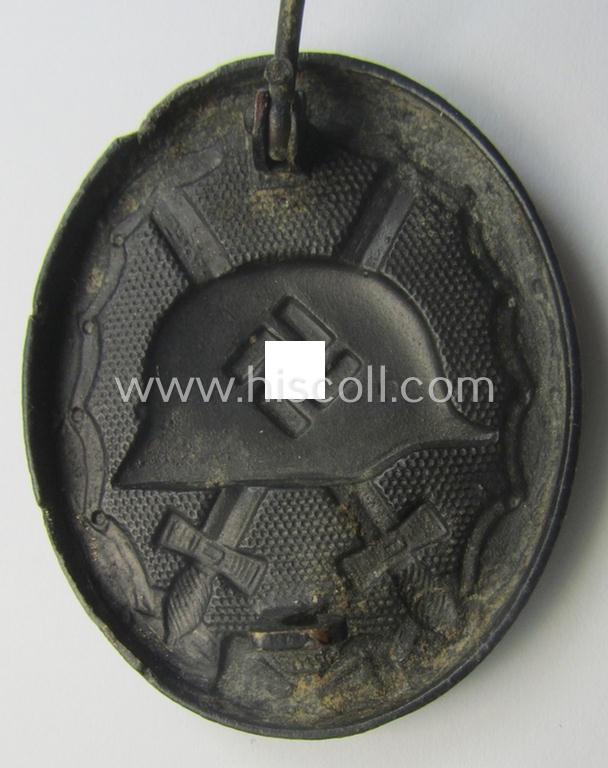 Neatly maker- (ie. '118'-) marked example of a black-class wound-badge (or: 'Verwundeten-Abzeichen in Schwarz') being an example that was produced by the (Austrian-based) maker (ie. 'Hersteller') named: 'August Menze & Sohn'