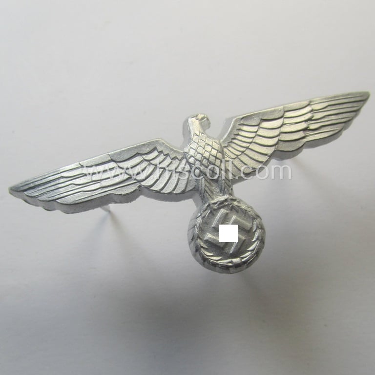 Superb, WH (Heeres) bright-silver-toned (ie. aluminium-based), EM- (ie. NCO- or officers') type visor-cap-eagle being a clearly maker- (ie. 'F.L.L.'-) marked and/or '38'-dated example that comes in a 'virtually mint- ie. unissued'-, condition