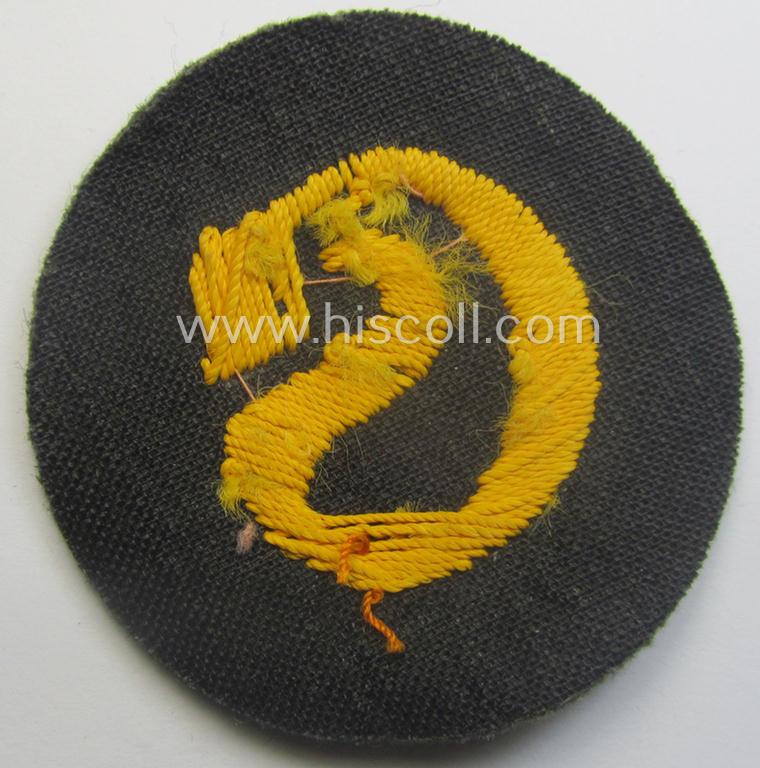 WH (Heeres) so-called: trade- and/or special-career arm-insignia (ie. 'Laufbahn- o. Tätigkeitsabzeichen') as intended for a: 'Schirrmeister' (being a neatly hand-embroidered variant as mounted onto a field-grey-coloured- and woolen-based backgrou...