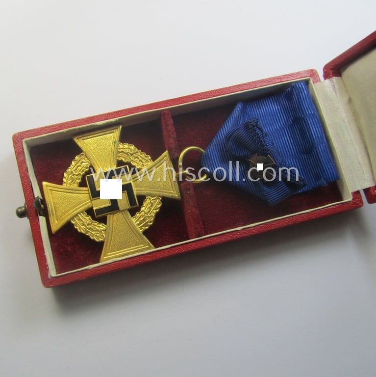 'Treuedienst Ehrenzeichen 1. Klasse' being a (typical) non-maker-marked example that came mounted onto its original ribbon (ie. 'Bandabschnitt') and that comes stored in its etui as issued