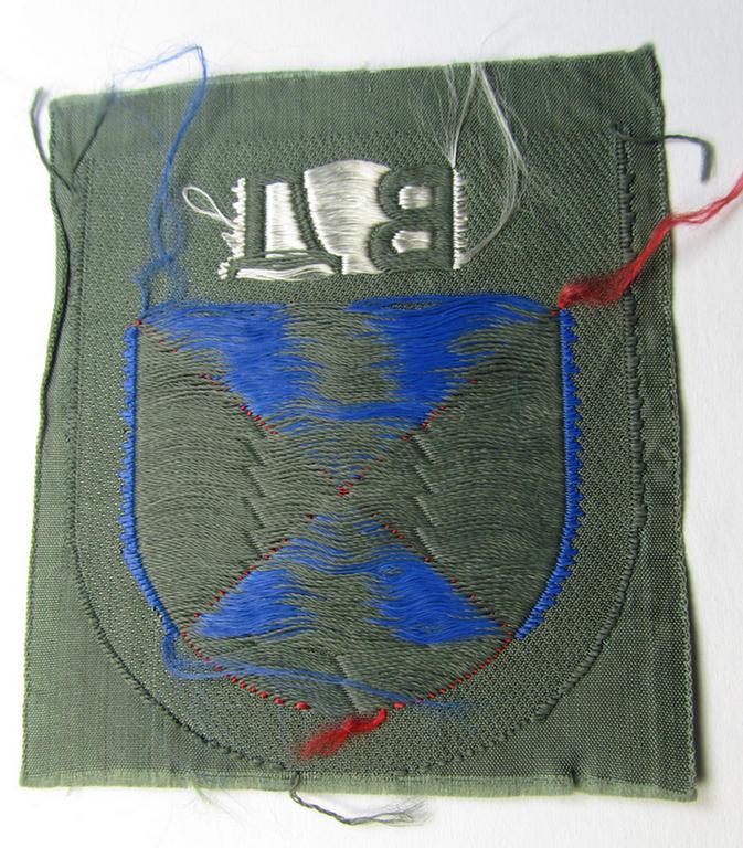 Attractive - and rarely seen! - armshield as executed in the neat 'BeVo'-weave pattern depicting the interwoven 'Cyrillic' characters: 'BA' (as was intended for the Russian volunteers serving within the 'Don Cossacks')