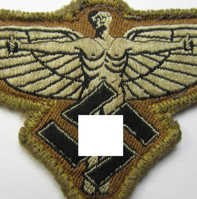 Tan-coloured, so-called: N.S.F.K.- (or: 'National Socialistisches Flieger Korps') breast-eagle being a nicely woven- (and enlisted-mens'-pattern) example that comes mounted on its piece of tan-coloured wool