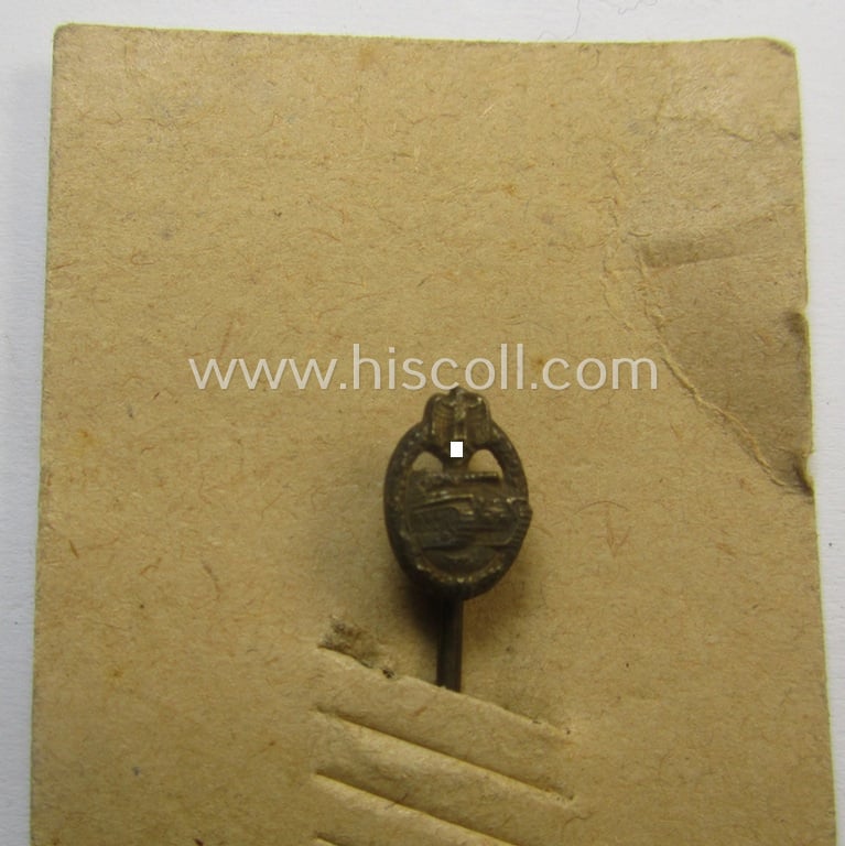 Neat - and only 9 mm. sized! - miniature-lapel-pin depicting a: 'Panzerkampfabzeichen in Bronze' (or: bronze-class panzer-assault-badge ie. PAB) being a non-maker-marked example that comes mounted onto its period 'LDO'-card
