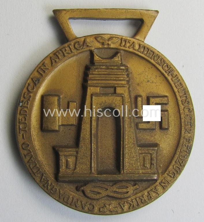 Superb, golden-bronze-coloured- (and I deem 'Buntmetall'-based-) example of a: 'Deutsch-Italienische Feldzugsmedaille' (or: German-Italian campaign medal) that came together with its (regular-sized) piece of original ribbon