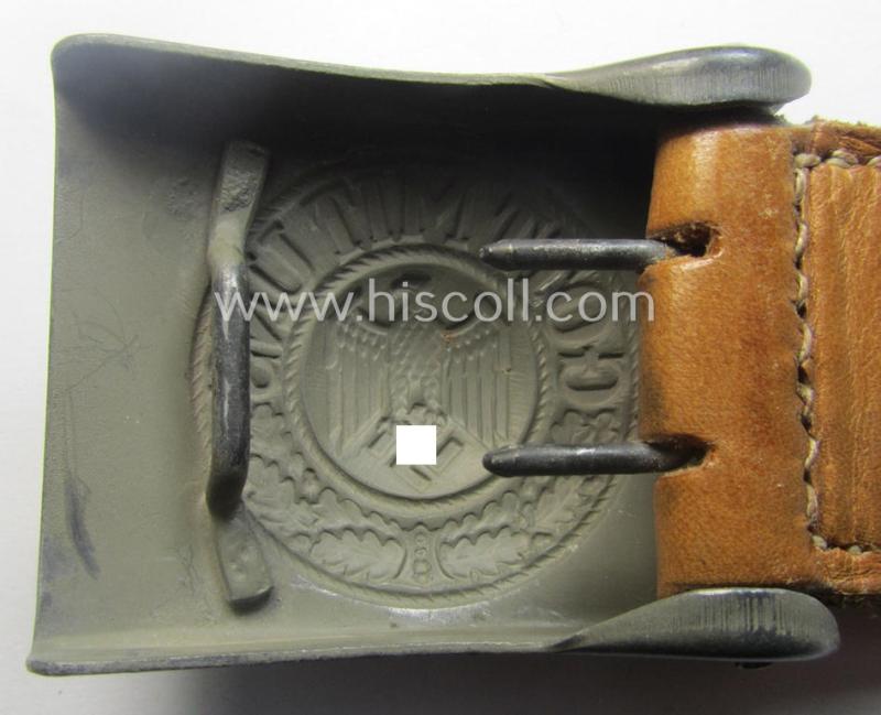 'Virtually mint', 'standard-issue'-pattern, WH (Heeres) field-grey-toned- and steel-based belt-buckle being a non-maker-marked example that comes mounted onto its 'G.H. Osang'-marked and/or '1940'-dated tab