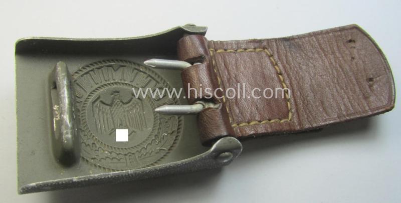 WH (Heeres) 'standard-issue'-pattern, field-grey-toned- and aluminium-based belt-buckle being a maker- (ie. 'G. Brehmer'-) marked- and/or: '1938'-dated example onto its leather-based tab