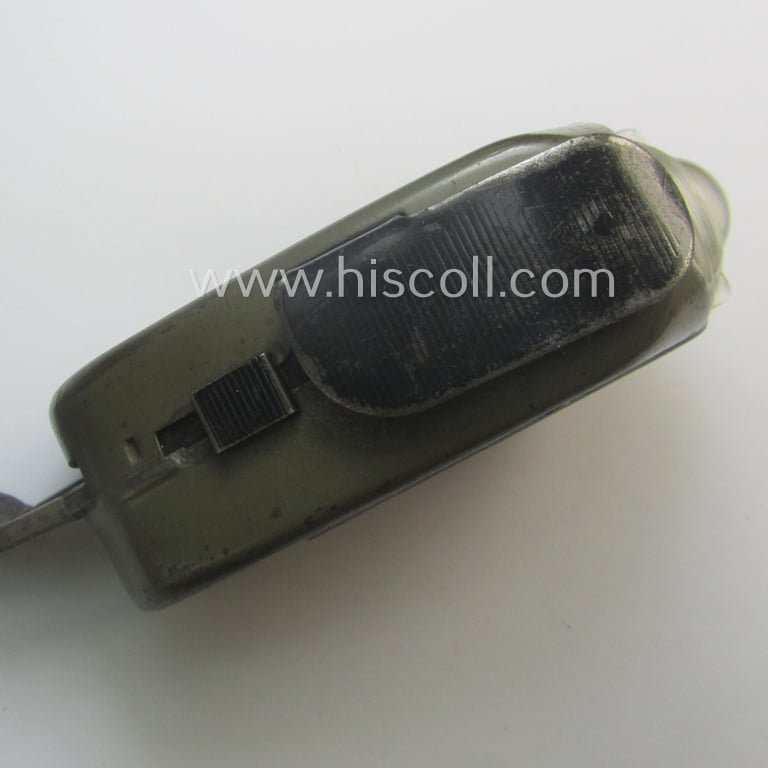 Superb - and in this official 'Wehrmacht'-issue-pattern rarely encountered! - example of a Dutch-produced, WWII-period, 'Philips - Type 7424-93' hand-operated flash-light, (aka: 'Knijpkat') clearly stamped: 'Wehrmachteigentum'