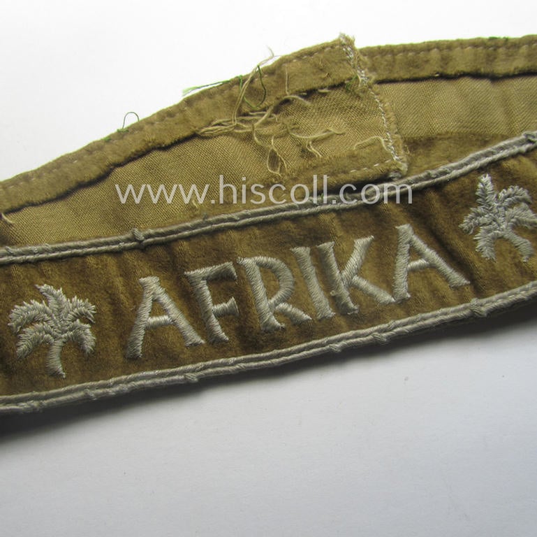 Cleary worn WH cuff-title (ie. 'Ärmelstreifen') entitled: 'Afrika' (being a minimally shortened example that comes in an overall very nice- (ie. issued and clearly worn ie. once tunic-attached-), condition