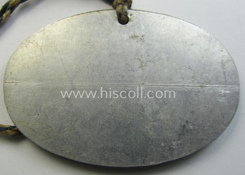 Very unusual, aluminium-based RLB- (ie. 'Reichs-Luftschutzbund'-) related ID-disc bearing the clearly stamped unit-designation that simply reads: 'Stadtsverw. Breslau - Luftschutz Nr. 3983 ES' and that comes mounted onto  its period cord