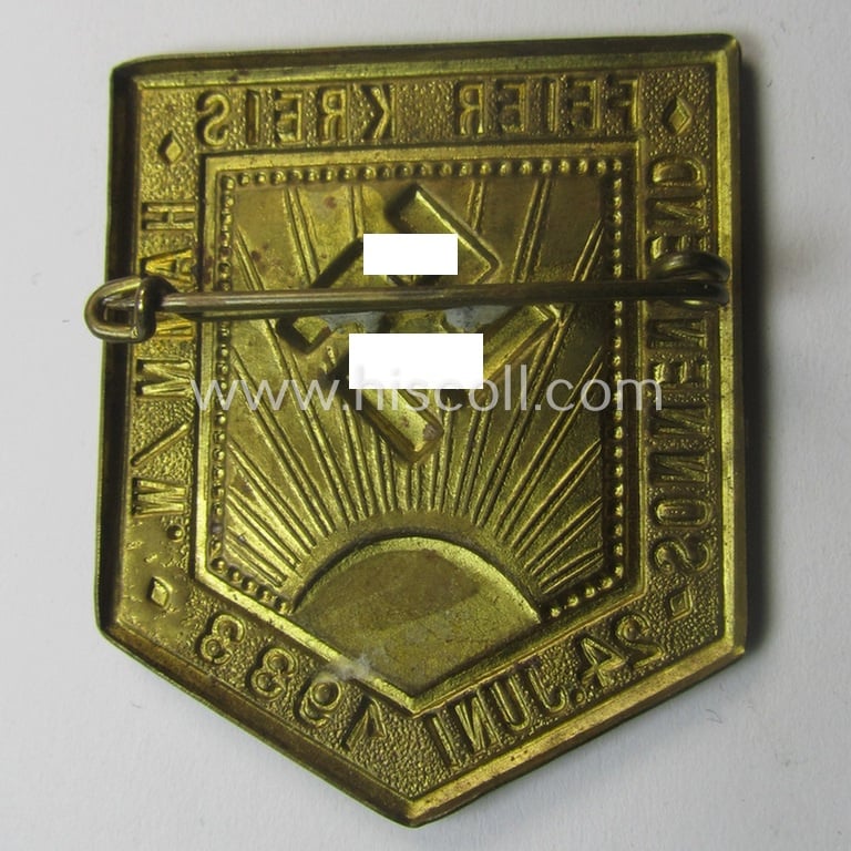 Commemorative, golden-bronze-toned, so-called: 'N.S.D.A.P'-related day-badge (ie. 'tinnie') showing an illustration of a sun-burst and swastika coupled with the text: 'Sonnenwend-Feier - Kreis Hamm/W. - 24 Juni 1933'