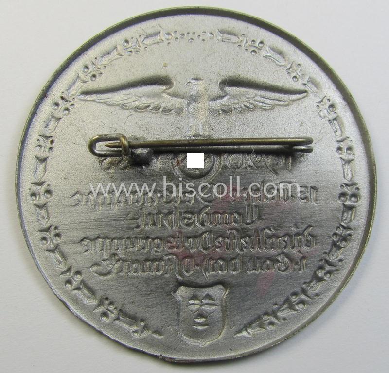 Commemorative, silverish-toned-, 'N.S.D.A.P.'-related 'tinnie' depicting an N.S.D.A.P.-party-eagle and surrounded by the text: '15 Jahre Ortsgruppe Landshut - die älteste Ortsgruppe i. Gau bay. Ostmark - 1920 -1935'