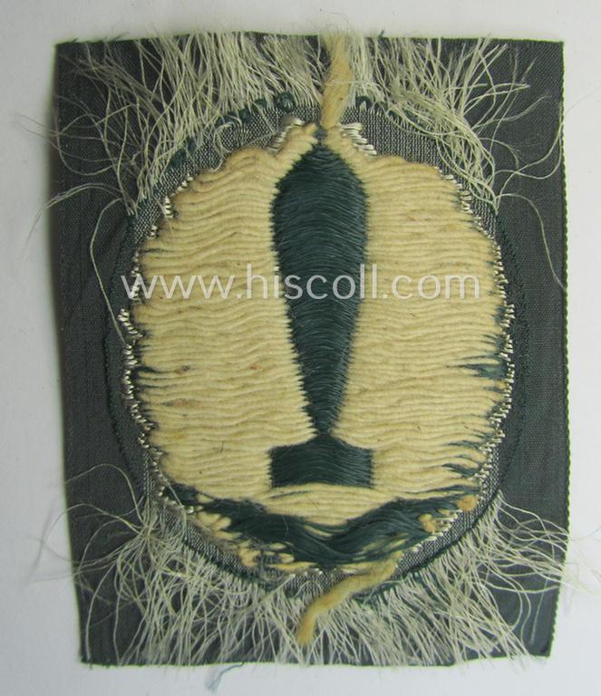 WH (Heeres): trade- and/or special-career-insignia: 'Nebelwerfer Richtkannonier' (or: qualified smoke-troops canon-operator) as executed in the neat 'BeVo-weave'-pattern