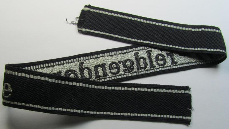 Superb - and truly rarely encountered! - example of a Waffen-SS, 'semi-BeVo'-pattern, EM- (ie. NCO-) type cuff-title (ie. 'Ärmelstreifen') as was intended for a member serving within the: 'SS-Feldgendarmerie'