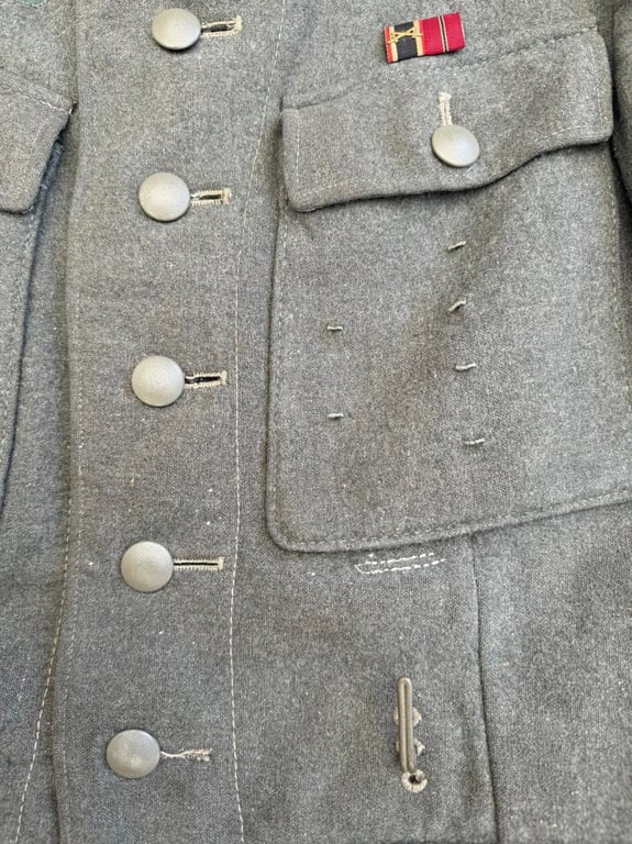 Wehrmacht Heer M43 EM field tunic With Original Applied Insignia