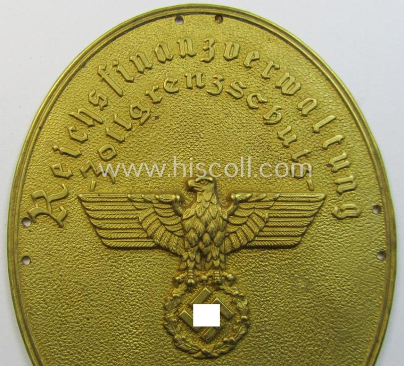 Attractive - bright-golden-toned- and/or metal-based - so-called: 'Reichsfinanzverwaltung-Zollgrenzschutz'-related armshield being a hardly used example that is bearing the stamped (unique) serial-number: '8435'