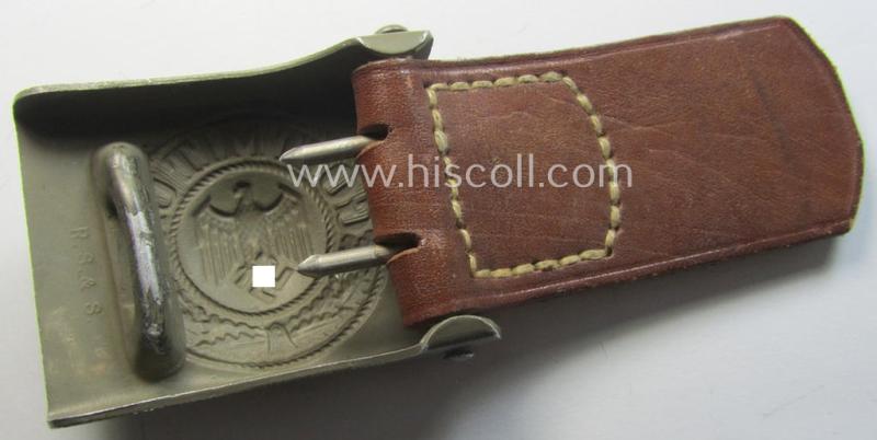 WH (Heeres) 'standard-pattern', field-grey-toned- and aluminium-based belt-buckle being a maker- (ie. 'R. Sieper & Söhne'-) marked- and/or: '1938'-dated example that comes mounted onto its leather-based tab