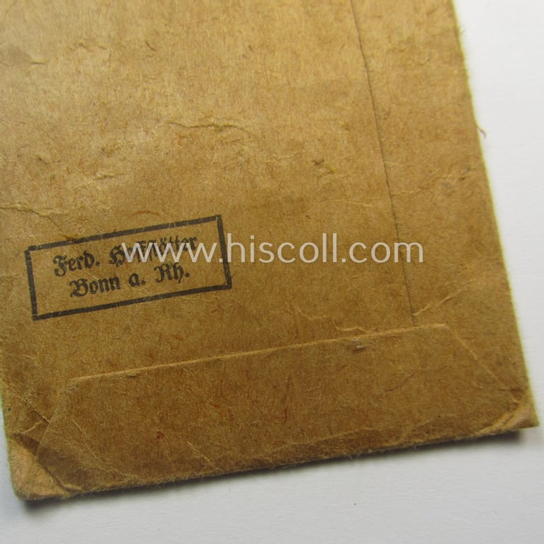 Medal-set: 'Deutsches Schutzwall Ehrenzeichen' (aka: 'Westwall'-medal) being a (typical) non-maker-marked- and/or: typical 'Buntmetall'-based specimen that comes packed in its original pouch of issue by the: 'Ferd. Hoffstätter'-company