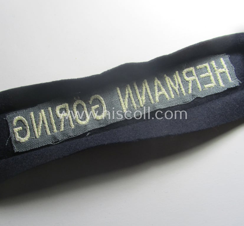 Typical 'smooth-woolen'-based, EM- (ie. NCO-) pattern WH (Luftwaffe) cuff-title (ie. 'Ärmelstreifen') entitled: 'Hermann Göring' that comes in that comes in a presumably issued- albeit (I deem) never worn, condition