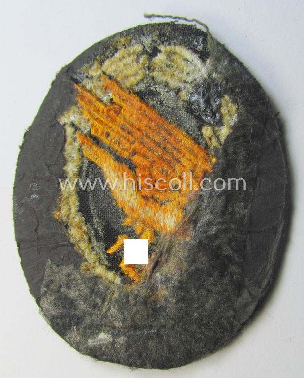 Superb, WH (Luftwaffe) 'Fallschirmschützen-Abzeichen in Stoff' (or: cloth-based paratroopers'-jump-badge) being a nicely machine-embroidered specimen that comes in a clearly issued, moderately worn and/or carefully tunic-removed-, condition