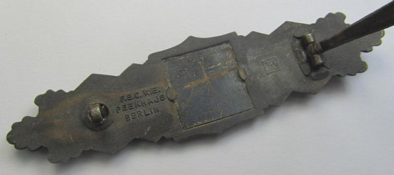 'Nahkampfspange in Bronze' (or: bronze-class close-combat clasp ie. CCC) being a neatly maker-marked- and/or minimally converse-shaped specimen as was produced by the: 'JFS'- (ie. 'Joseph Feix u. Söhne'-) company
