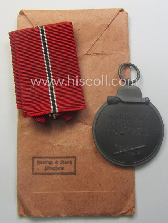 Medal-set: 'Winterschlacht im Osten 1941/42' as produced by the: 'Förster & Barth'-company being a clearly maker- (ie. '10'-marked) specimen that came stored in its original 'Zellstoff'-based pouch of issue as found