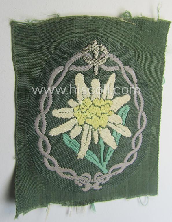 Attractive - 'variant'- ie. first-pattern! - WH (Heeres) 'Gebirgsjäger'- (ie. mountain-troopers-) related arm-badge, being a desirable example as was executed in the 'BeVo'-weave pattern on a field-grey-coloured background