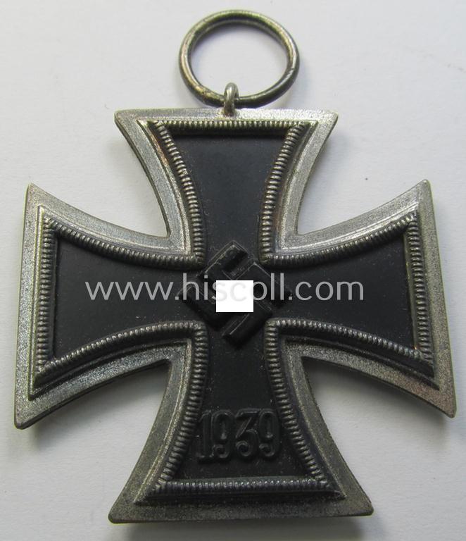 'Eisernes Kreuz II. Klasse' being a non-maker-marked example that comes together with its original- and once-mounted ribbon (ie. 'Bandabschnitt') as was produced by a (by me) unidentified maker (ie. 'Hersteller')