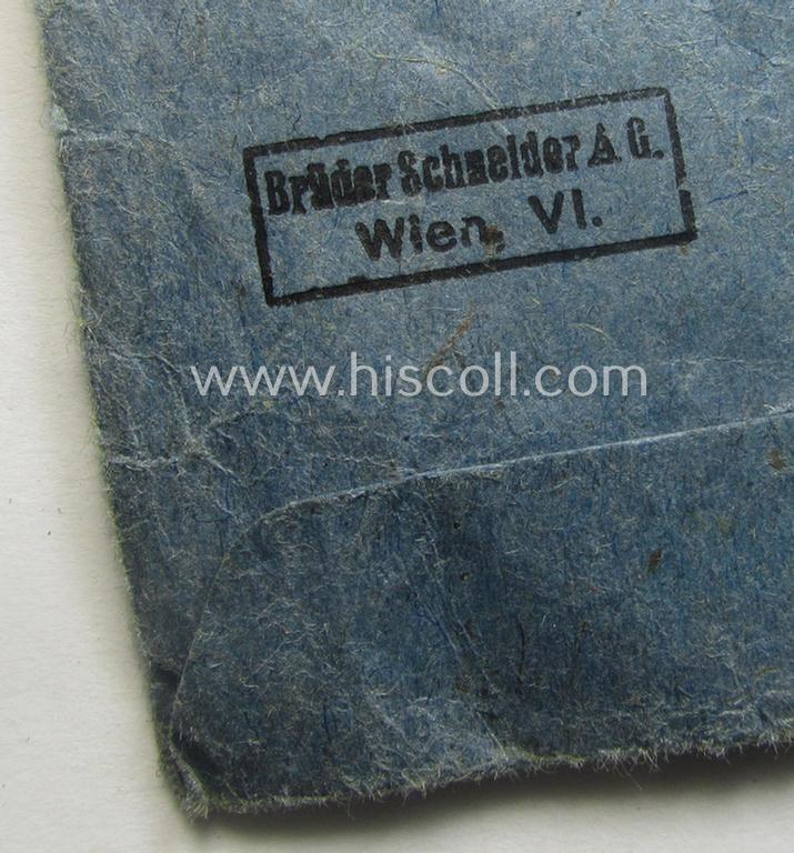 Medal-pouch entitled: 'Eisernes Kreuz 2. Klasse 1939' being a (typical) bluish-coloured example as executed in: 'Zellstoff'-based paper as was produced by the (Austrian) maker- (ie. 'Hersteller'): 'Brüder Schneider A.G. - Wien VI'