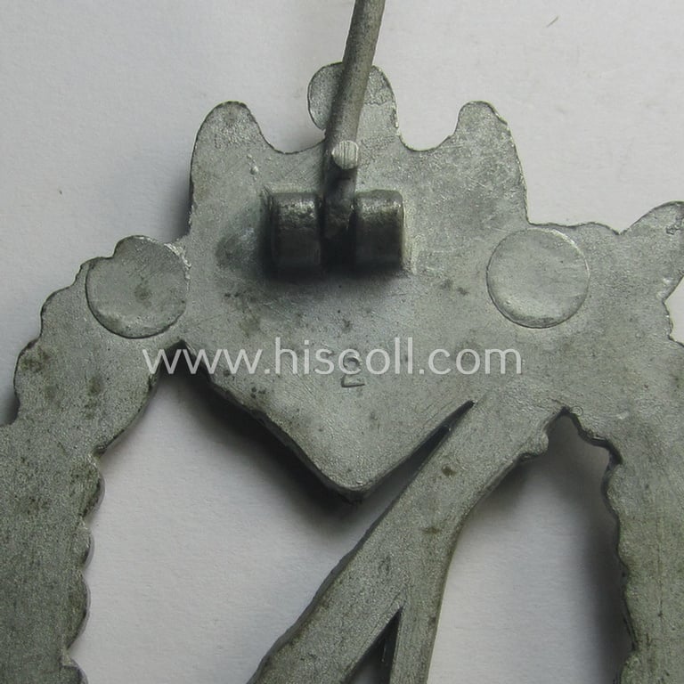 WH (Heeres- ie. Waffen-SS) 'Infanterie-Sturmabzeichen in Silber' (or: silver-class infantry assault-badge ie. IAB) being a maker- (ie. '2'- ie. 'Assmann') marked so-called: 'molded-pattern'-example as executed in zinc-based metal