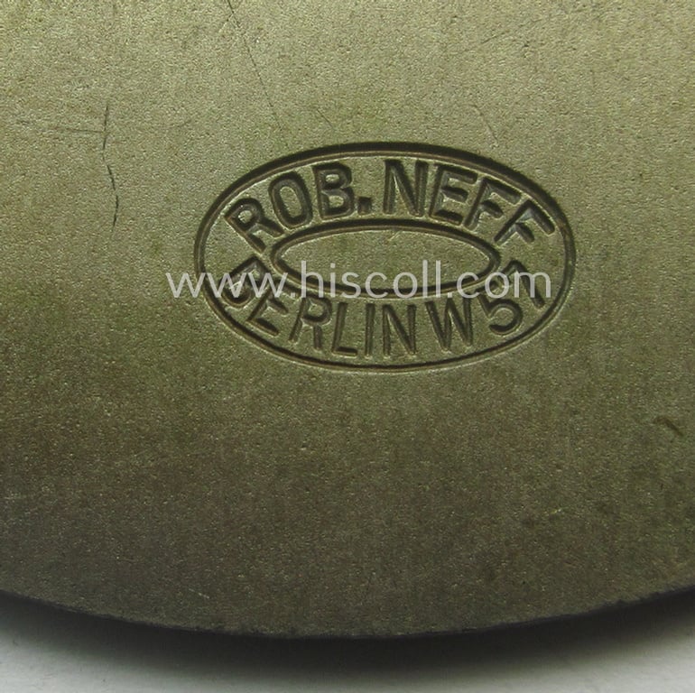Commemorative N.S.K.K.-/D.D.A.C.-related car-plaque (ie. 'Erinnerungs- o. nichttragbare Kfz-plakette') showing a hand holding a car and text: 'Zielfahrt zur internationalen Automobil- und Motorrad-Ausstellung - Berlin - 1934'