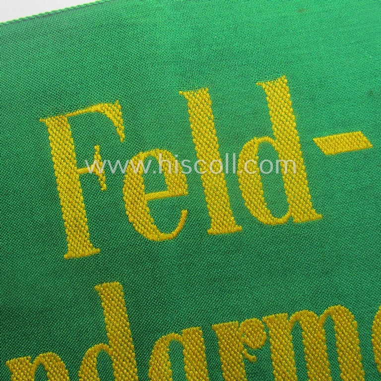 Wehrmacht-related, bright-green-coloured and/or linnen-based armband entitled: 'Feldgendarmerie' (as was specifically intended for usage by the staff of the notorious: 'Feldgendarmerie-Truppen')