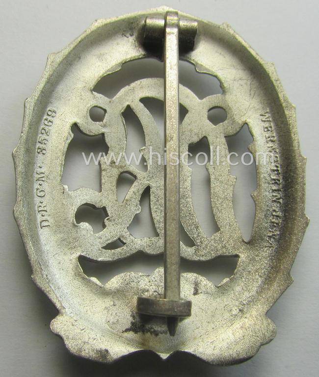 'Reichssportabzeichen DRL in Silber' (or: silver-class DRL sports'-badge) being a typical 'Buntmetall'-based example that is maker- (ie. 'Wernstein - Jena'-) marked