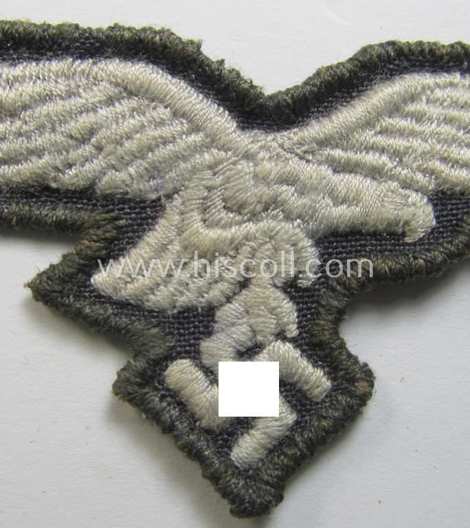 Neat, 'variant'-pattern, WH (Luftwaffe) EM- (ie. eventually NCO-) type side-cap eagle (being a 'virtually mint- ie. unissued' example as executed in typical machine-embroidered-pattern onto an unusally seen 'thin-shaped' background)