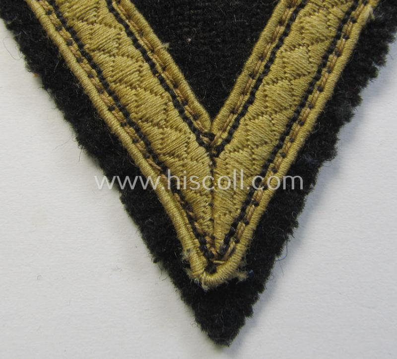 Truly used, Waffen-SS-type 'Armwinkel' (or: rank-chevron) as executed on black-coloured wool as was specifically intended for usage by an SS-soldier with the rank of: 'SS-Sturmmann'