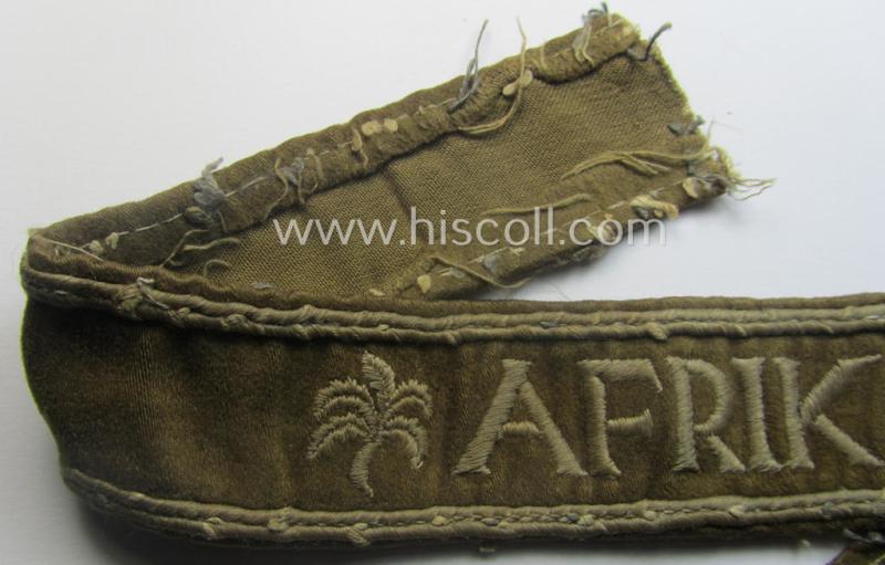 Neat, WH cuff-title (ie. 'Ärmelstreifen') entitled: 'Afrika' that comes in a clearly issued, worn- and/or most certainly once tunic-attached, condition