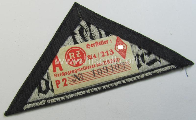 'HJ' ('Hitlerjugend') ie. 'BDM'- ('Bund Deutscher Mädel') district-triangle (ie. 'Gebietsdreieck') entitled: 'Ost Sudetenland' (being a hardly used- nor worn example that still retains its period-attached 'RzM'-etiket)