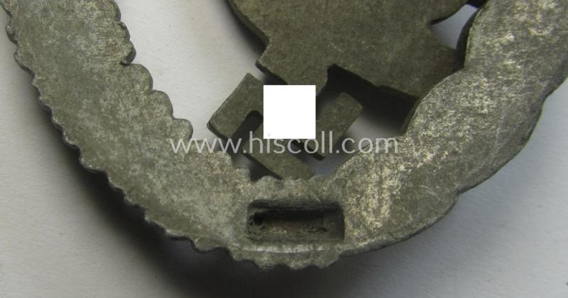 Regrettably incomplete, WH (Luftwaffe) 'Fallschirmschützen-Abzeichen' (or: paratroopers-jumpbadge) being a neatly maker- (ie. 'B&N - L'-) marked- and typical zinc- (ie. 'Feinzink'-) based example by the maker: 'Berg u. Nolte'