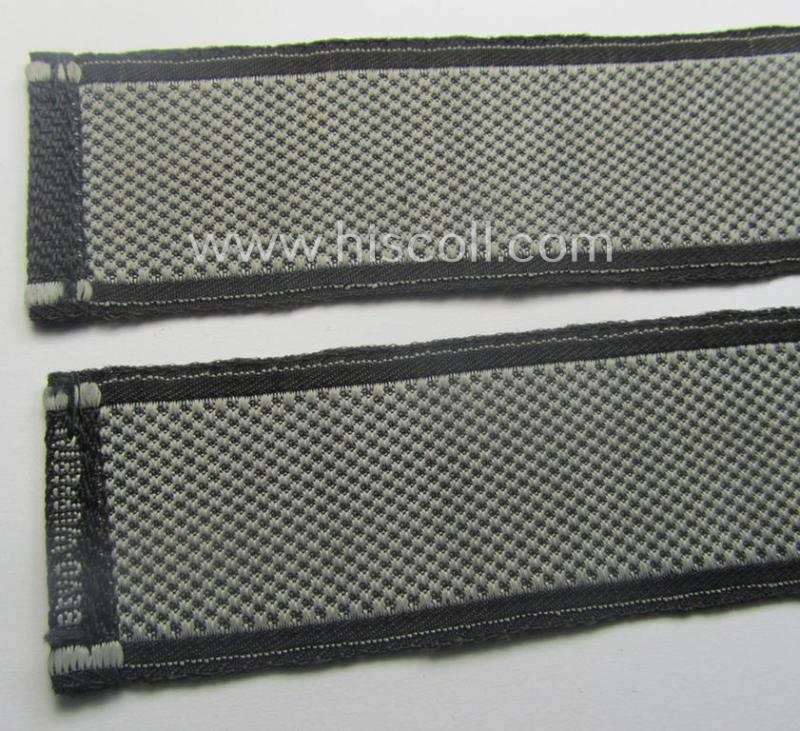 Waffen-SS, 1943/44 pattern cuff-title (ie. 'Ärmelstreifen') depicting the machine-woven Latin script text in silver-grey linnen as was intended for a member of the: 'SS-Regiment': "Westland" (ie. part of the: '5. SS-Pz-Gren.-Div. "Wiking")