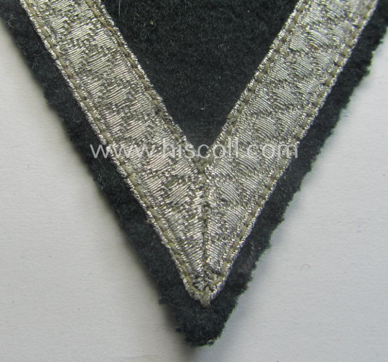 WH (Heeres) 'Armwinkel' (or: arm-chevron) as executed on typical darker-green-coloured wool as was specifically intended for usage by a soldier with the rank of: 'Gefreiter'