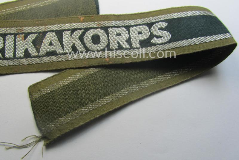 'BeVo'-like cuff-title (ie. 'Ärmelstreifen') entitled: 'Afrikakorps' being a presumably issued but simply never worn example that comes in an overall very nice- (ie. non-shortened- and never tunic-attached-), condition