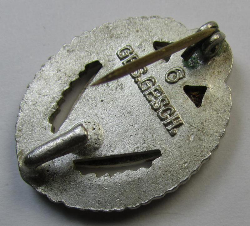 Honorary-membership lapel-pin (aka: 'Silberne Ehrennadel für 25 Jahre Mitgliedschaft im Nationalsocialistischer Reichskriegerbund' (ie. 'N.S.R.K.B.') being a maker- (ie. '6'-) marked example that also bears a: 'Ges.Gesch.'-designation on its...