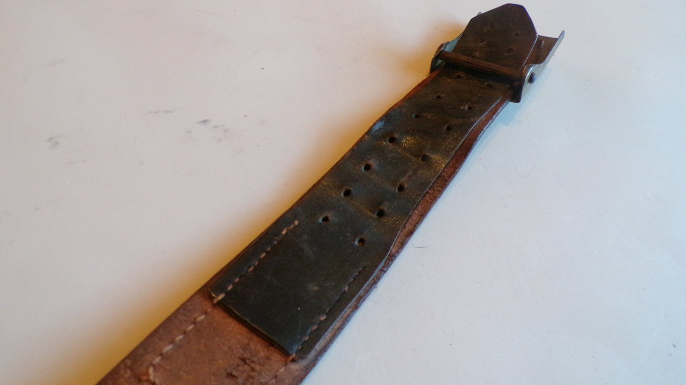 S.A brown leather belt and buckle