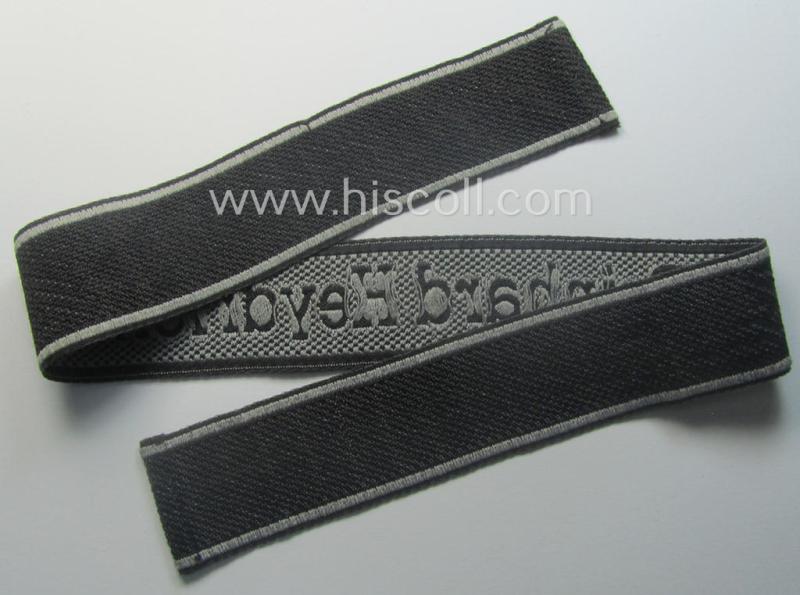 Waffen-SS, 1943-pattern cuff-title (ie. 'Ärmelstreifen') depicting the machine-woven Latin script text in silver-grey linnen as was intended for a member of the: 'SS-Geb.Jäg.-Rgts. 6. (u.11.)': "Reinhard Heydrich"